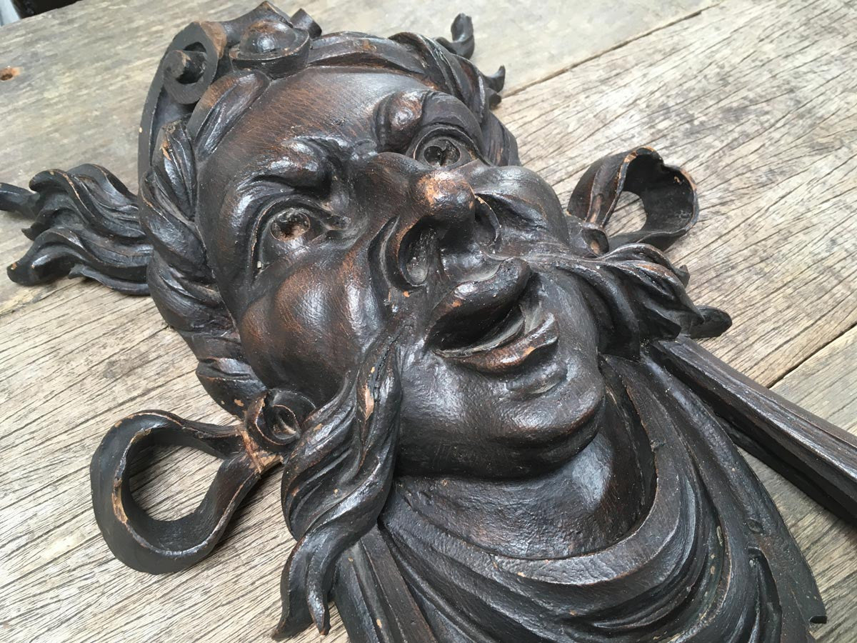 Moustachioed Man Carving