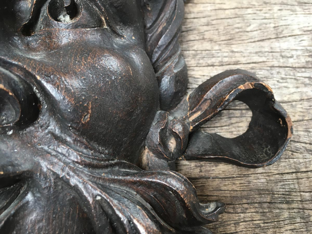 Moustachioed Man Carving