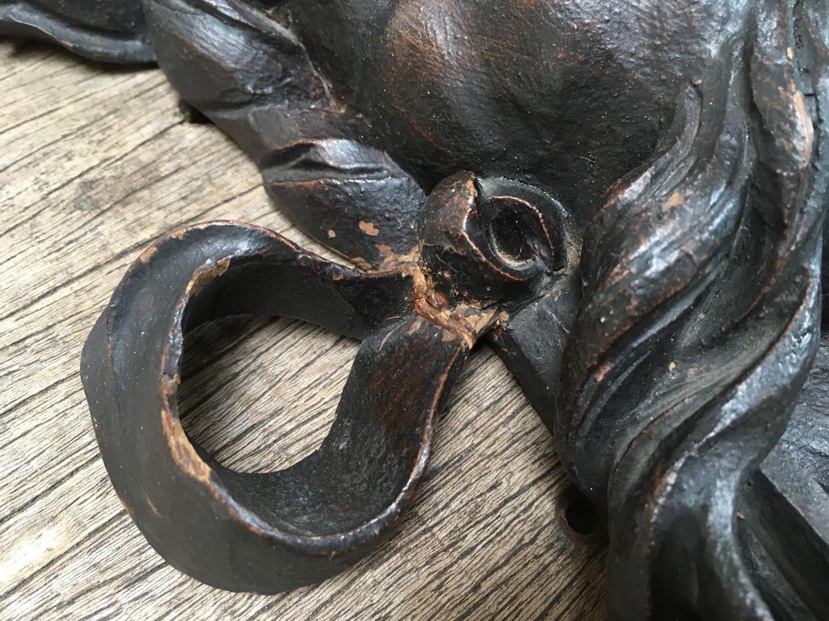 Moustachioed Man Carving