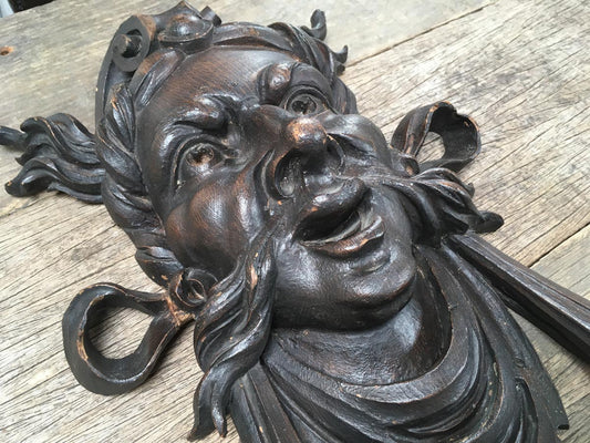 Moustachioed Man Carving