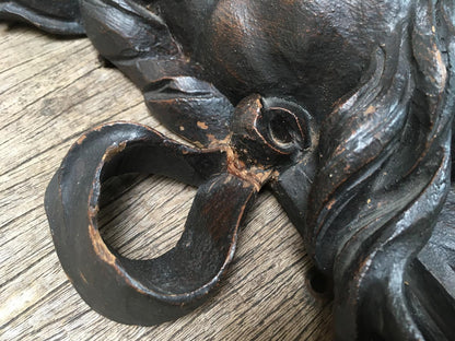 Moustachioed Man Carving